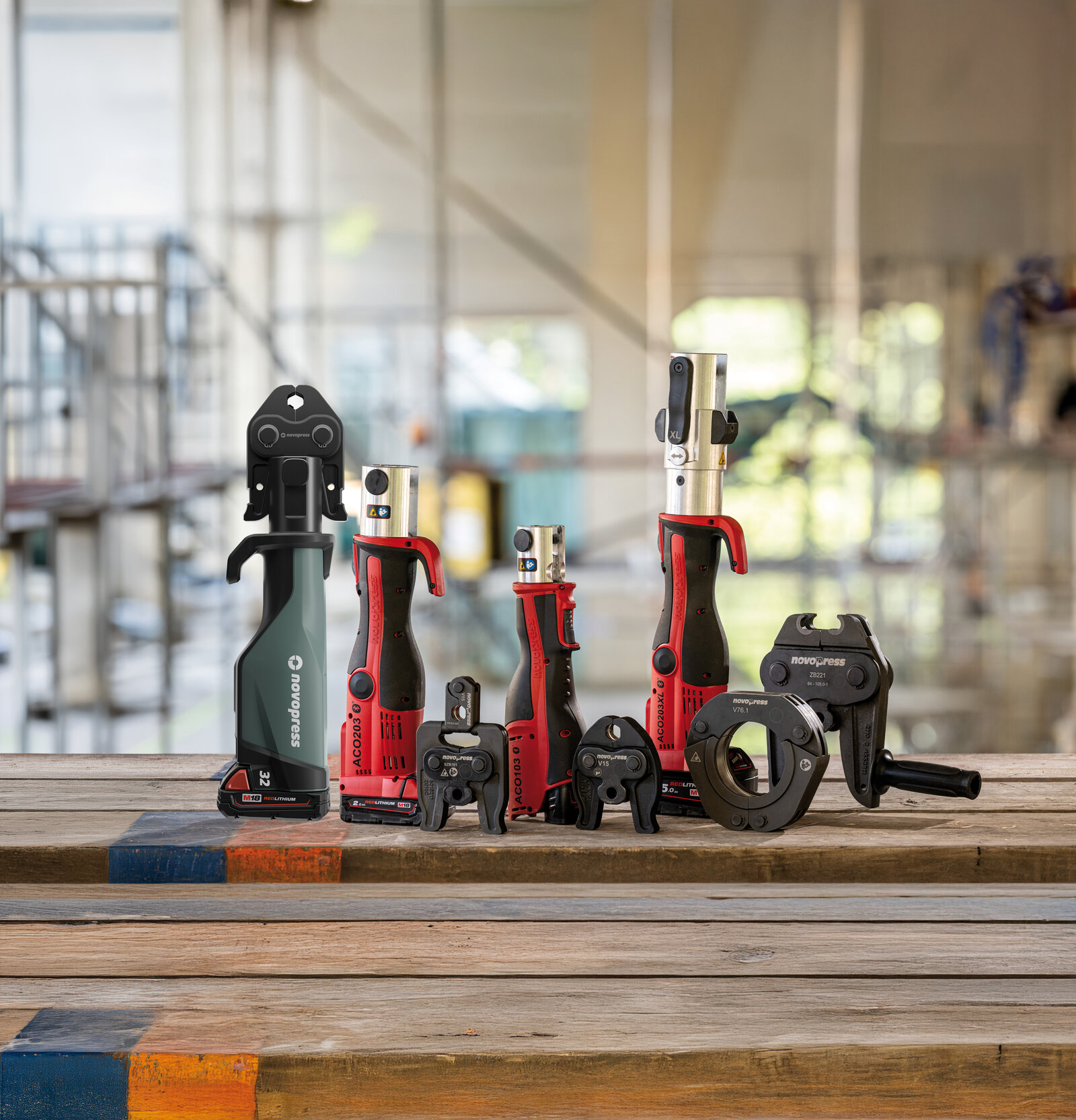 Novopress devices and jaws on a construction site table